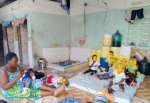 DINA koki with some of the children under her care