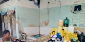 DINA koki with some of the children under her care