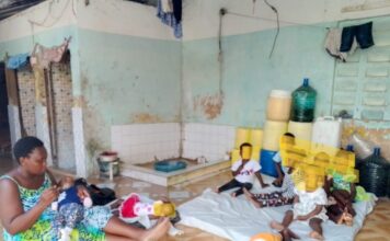 DINA koki with some of the children under her care