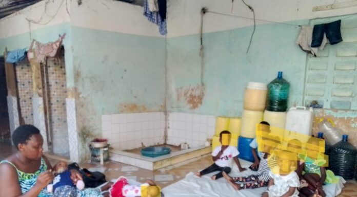 DINA koki with some of the children under her care